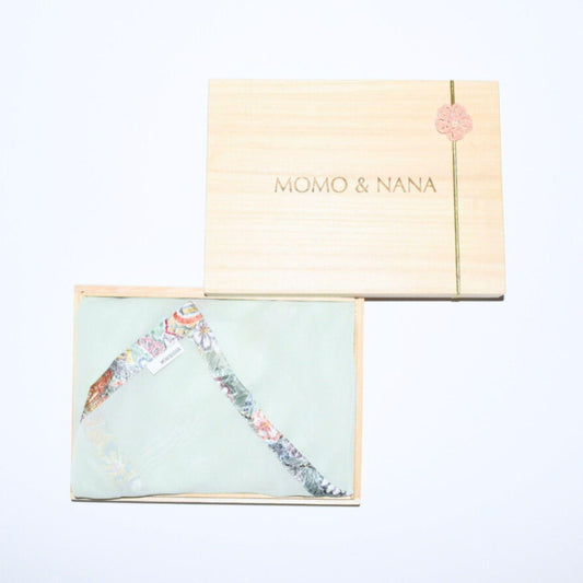 Awakening Spring: Premium green-blue kimono hijab in a traditional Japanese paulownia wood gift box. 100% vintage silk for elegant gifting.
