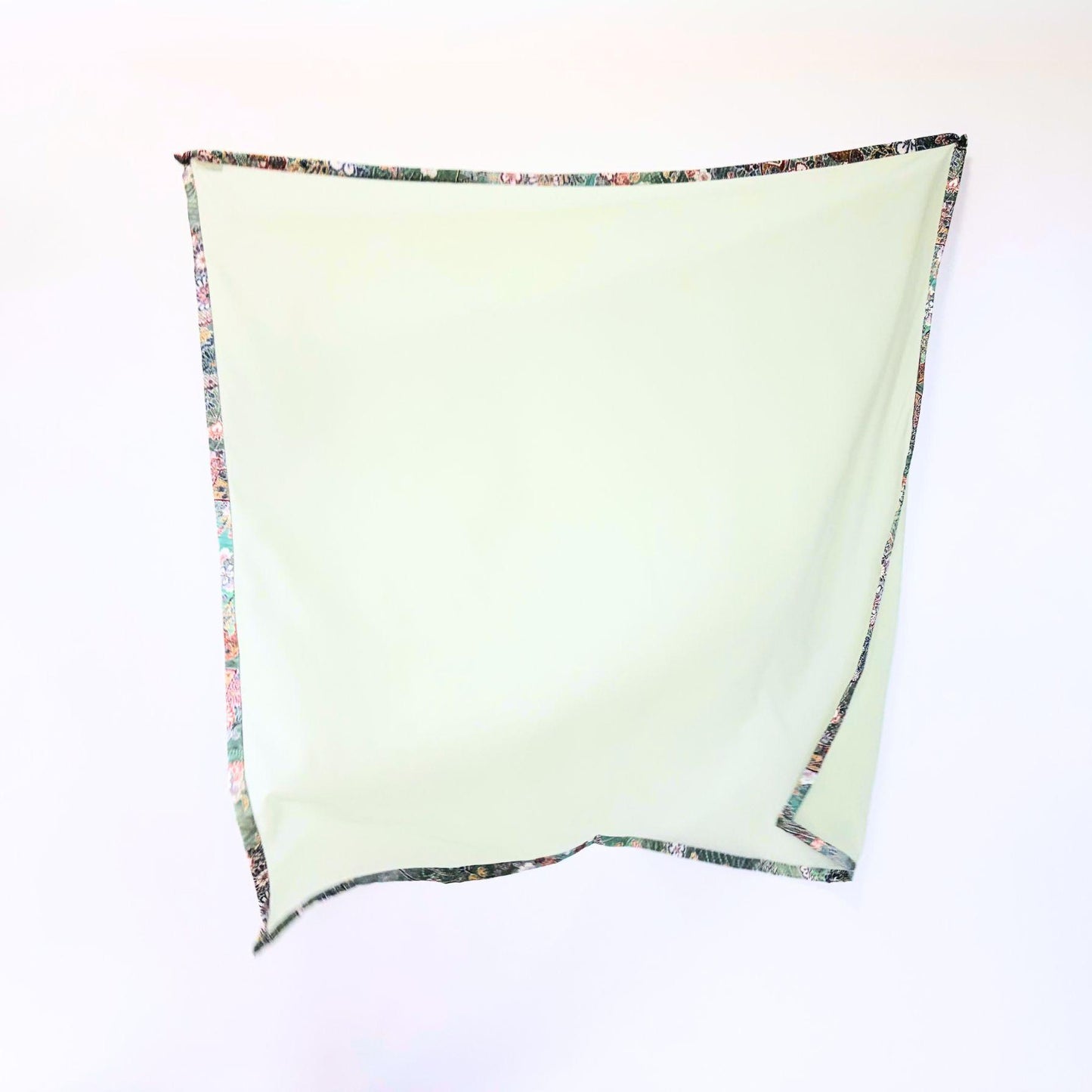 Full view of Awakening Spring kimono hijab showing vibrant green-blue tones and floral patterns on warm, authentic vintage Japanese silk.