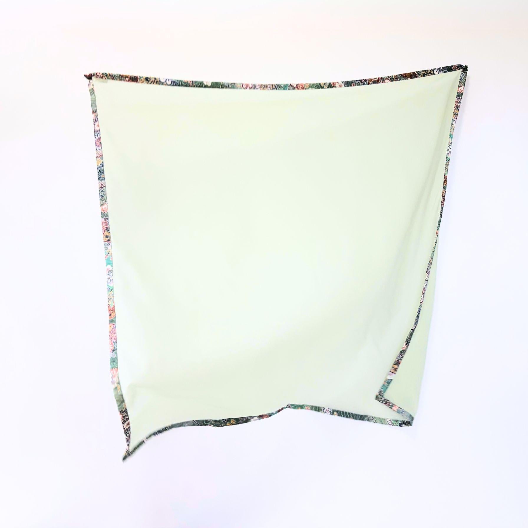 Full view of Awakening Spring kimono hijab showing vibrant green-blue tones and floral patterns on warm, authentic vintage Japanese silk.