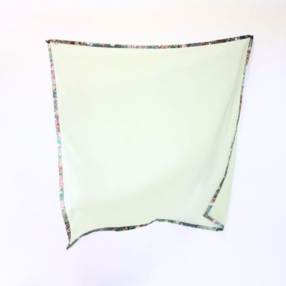 Full view of Awakening Spring kimono hijab showing vibrant green-blue tones and floral patterns on warm, authentic vintage Japanese silk.