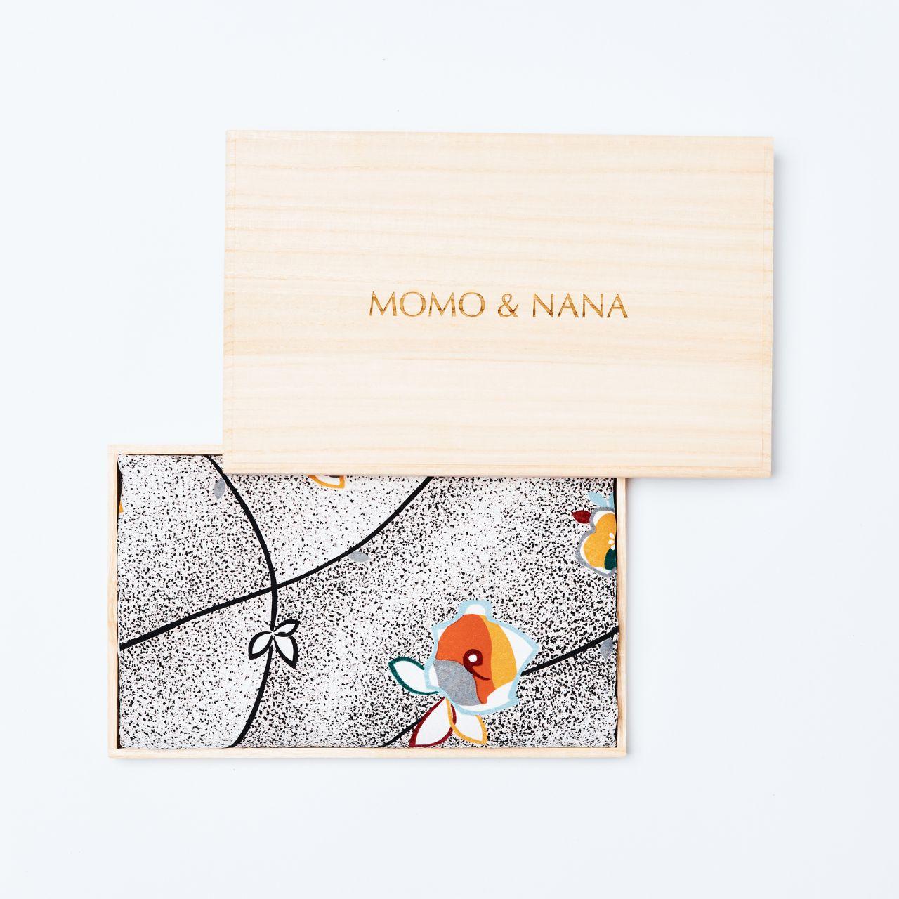 Premium "BUDDING MORNING" silk hijab by MOMO & NANA, presented in a traditional Japanese handcrafted paulownia wood box for an exquisite gifting experience.