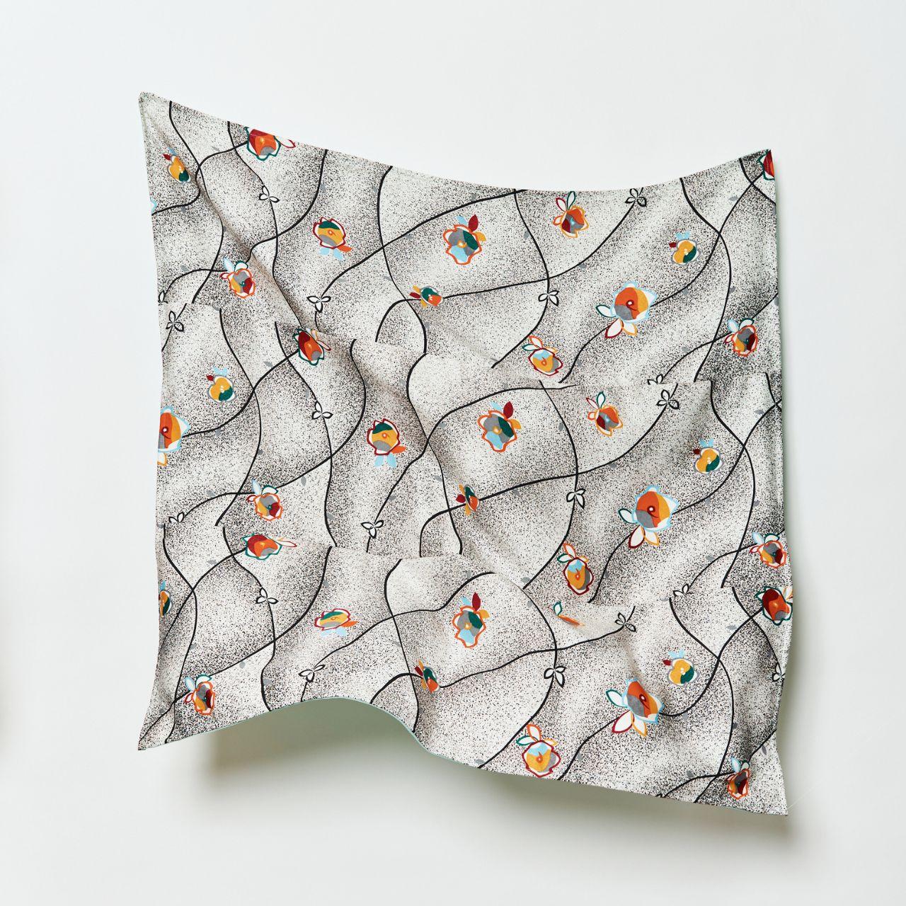 Close-up of the elegant drape and fine texture of the "BUDDING MORNING" upcycled silk hijab, showcasing the intricate detail of the repurposed Japanese textile.