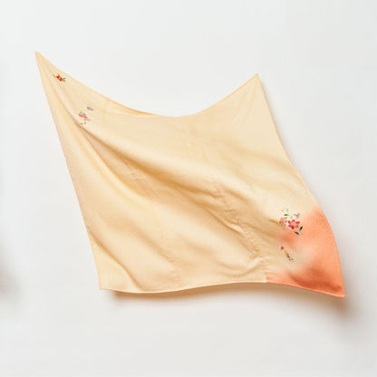 A flowing, lightweight Japanese silk cloth in pale peach and crimson gradient, featuring delicate hand-painted floral patterns and a subtle textured finish.