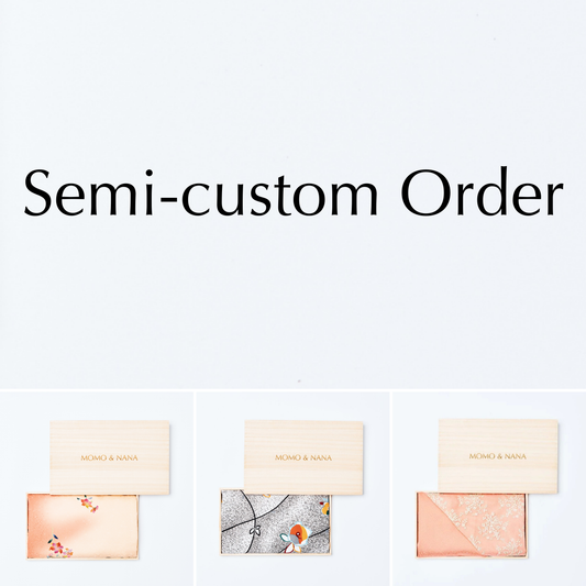 A variety of semi-custom order kimono hijabs by MOMO & NANA, showcasing different traditional patterns in elegant wooden boxes for personalized Japanese style.