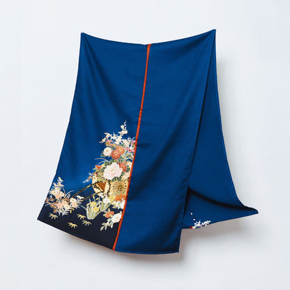 The "PATH THAT BIND" headscarf, a premium upcycled kimono silk hijab in deep indigo blue, featuring intricate hand-painted floral motifs and a signature orange silk border.